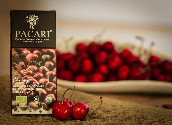 Pacari cherry chocolate bar with cherries on a wooden surface