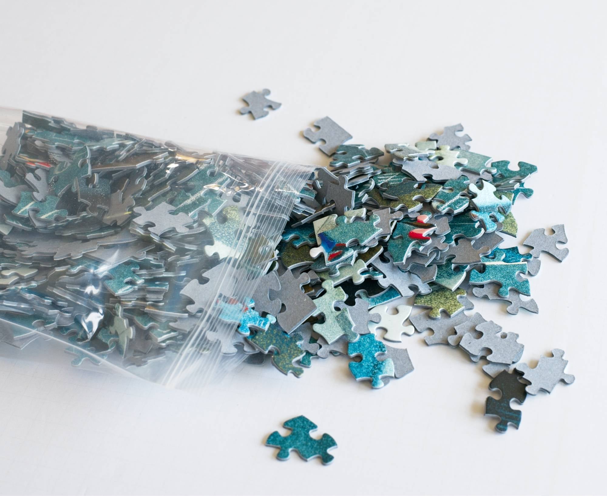 Resealable bag of Children's Games puzzle pieces from the 500-piece Eric Drooker puzzle