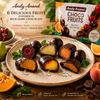 Close-up of dark chocolate covered fruit pieces in gift box