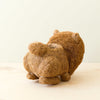 Coconut fiber animal-shaped planter on a light background