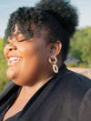 Side view of upcycled horn triple loop dangle earrings showing interwoven oval loop detail