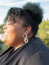 Fair Anita triple loop horn earrings styled on model showing dangle length and natural colour variation