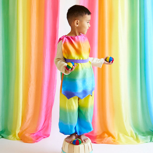 Unleash your child's inner jester with our Rainbow Jester Costume. This complete set includes a tunic, pants, and hat for endless fun and imaginative play. Perfect for parties, Halloween, and everyday adventures.