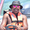 Cirque Wayfinder sunglasses in orange polarized lens — side profile view of abalone walnut frame