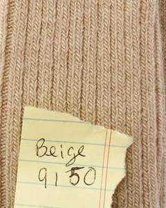 Beige fabric with a label indicating color code '9150'. Classic Alpaca Socks – soft, breathable, and versatile for year-round wear. Ethically made in Peru. Shop timeless alpaca comfort today.