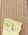 Beige fabric with a label indicating color code '9150'. Classic Alpaca Socks – soft, breathable, and versatile for year-round wear. Ethically made in Peru. Shop timeless alpaca comfort today.