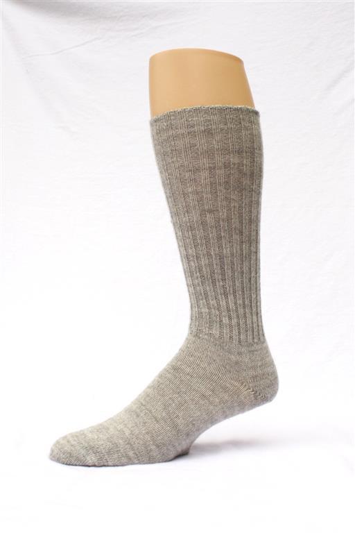 Gray knee-high sock on a mannequin leg against a white background. Classic Alpaca Socks – soft, breathable, and versatile for year-round wear. Ethically made in Peru. Shop timeless alpaca comfort today.