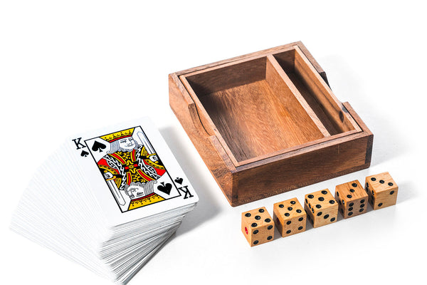 Wooden dice tray with playing cards and dice on a white background