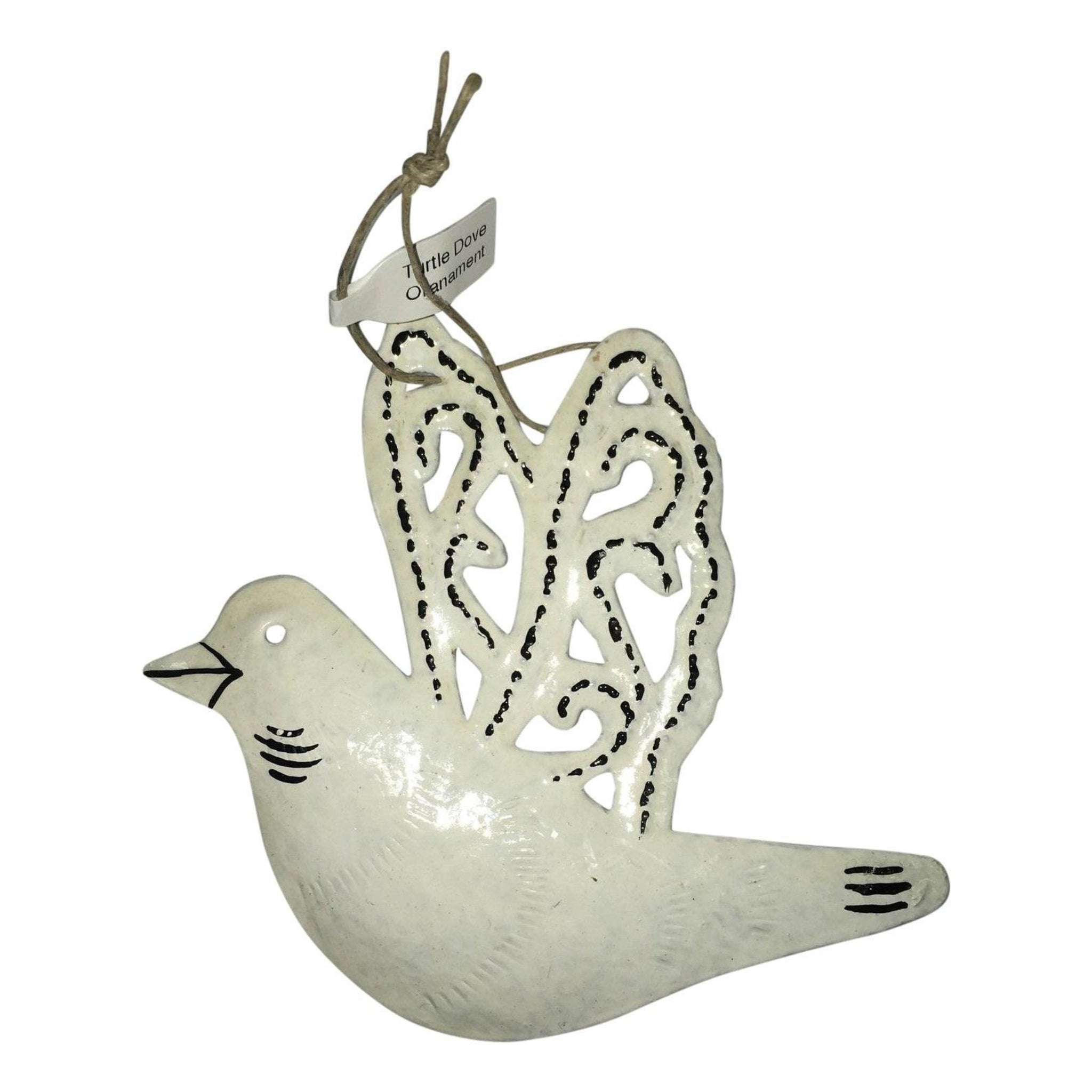 Four upcycled steel Christmas ornaments laid flat showing turtle dove, reindeer, snowflake and star designs from Singing Rooster Haiti