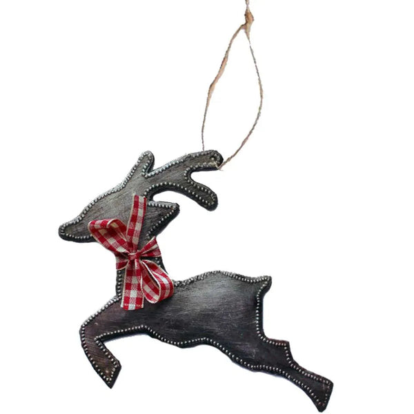 Decorative reindeer ornament with a red bow on a white background