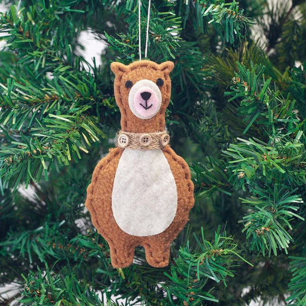 Felt bear ornament hanging on a Christmas tree
