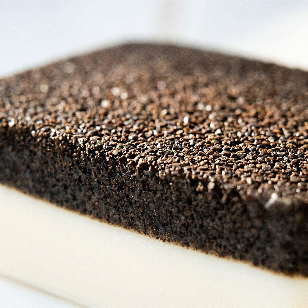 Close-up of a textured brown surface on a white background