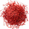 Red strands of saffron on a white background