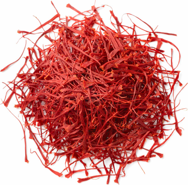 Red strands of saffron on a white background