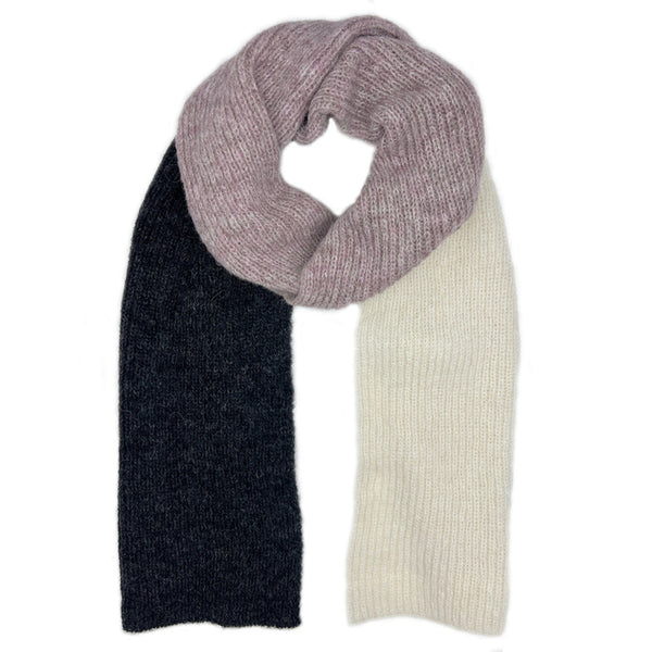 Multicolored knit alpaca scarf with purple, black, and white sections on a white background