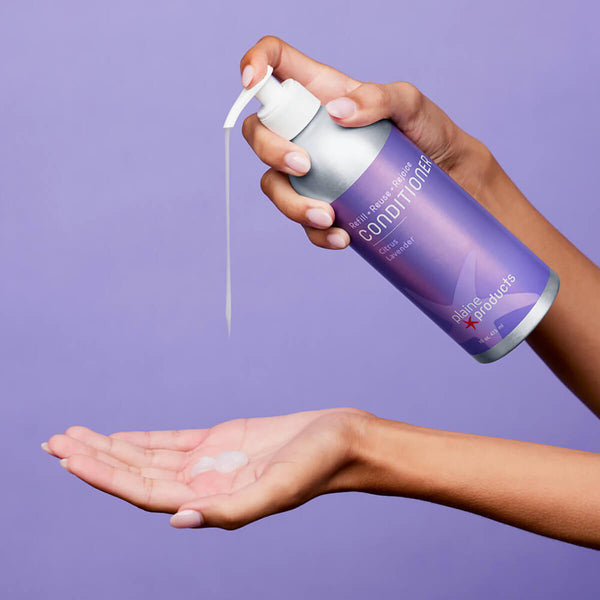 Person using Plaine Products sustainable conditioner for hydrated, shiny hair