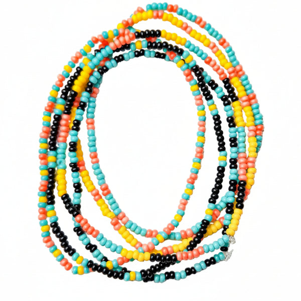 Set of colorful beaded necklaces on a textured white surface
