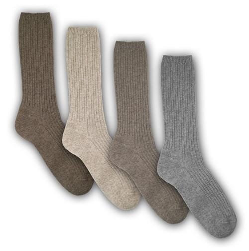 Four pairs of socks in brown, beige, and gray on a white background. Experience the benefits of our Copper Crew Alpaca Socks. Made with undyed alpaca and organic cotton, these socks feature heat-reflecting copper fibers. Machine washable and incredibly soft for daily comfort.