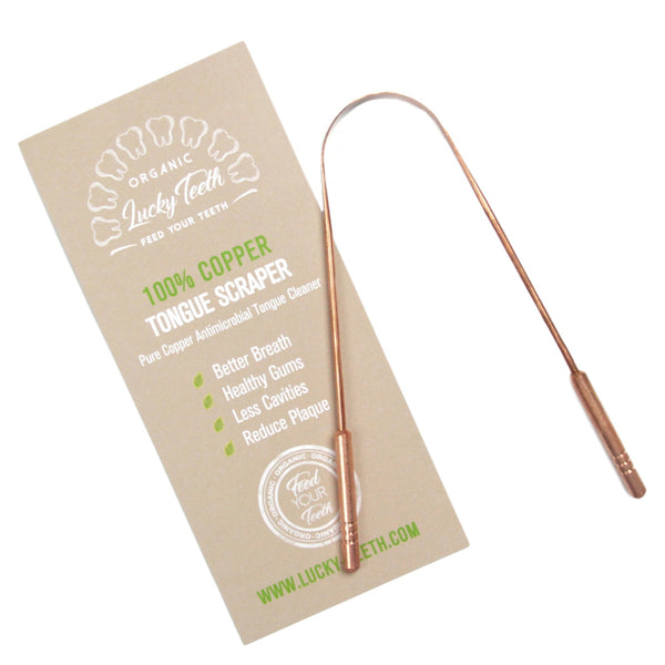 Copper tongue scraper with Lucky Teeth branded packaging on a white background