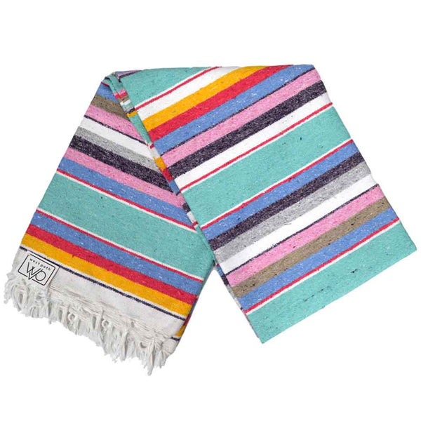 Colorful striped towel with fringes on a white background
