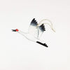 Decorative crane ornament on a white background