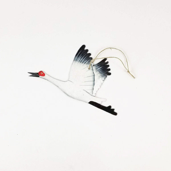 Decorative crane ornament on a white background