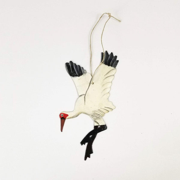 Decorative stork ornament on a white background