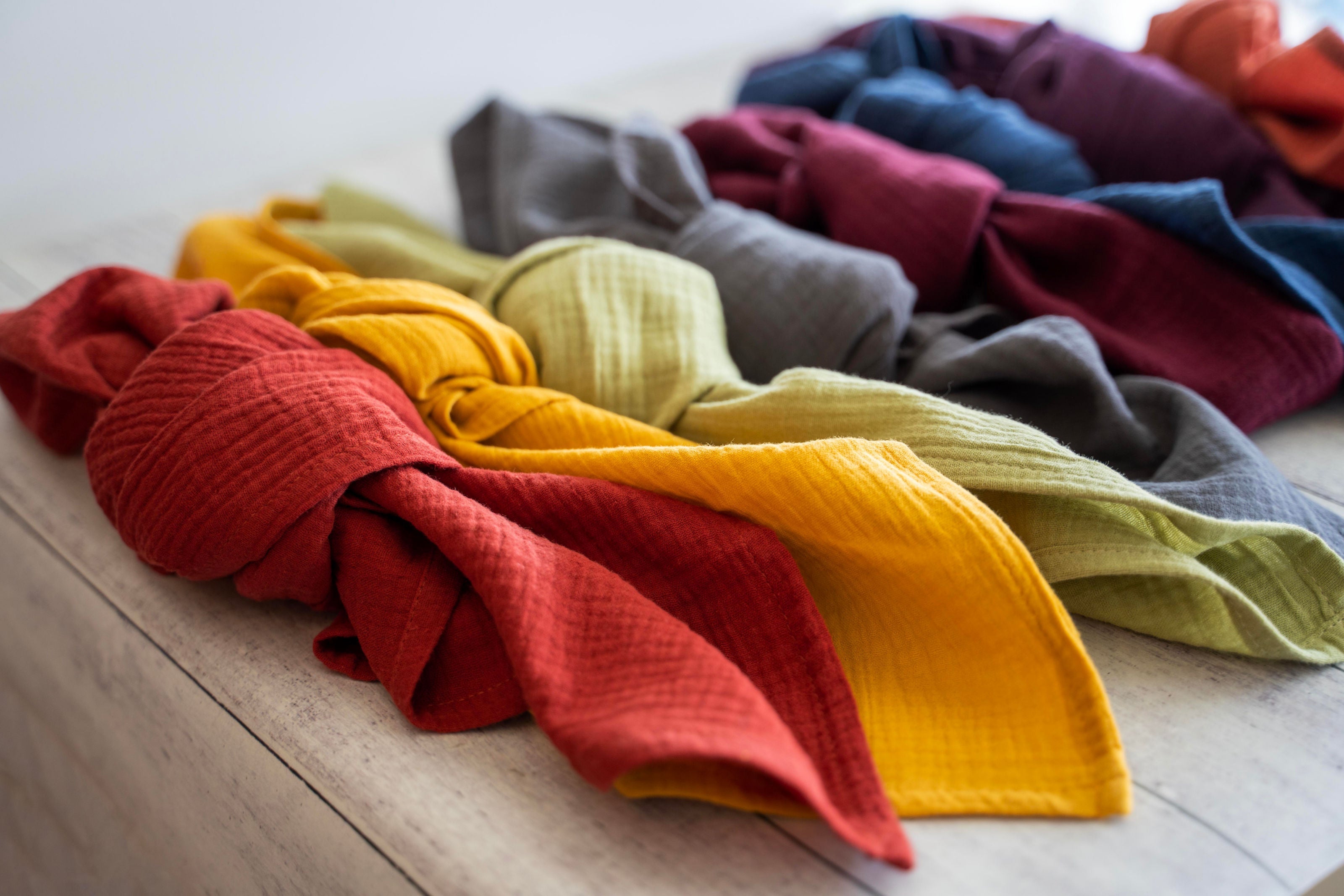 Folded cotton crinkle napkins in a neat stack showing texture and hemmed edges