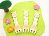 Alpaca snack fork in use at snack time, showing size and scale for small hands