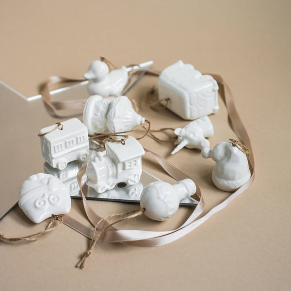 Close-up of glazed porcelain hot air balloon ornament handmade by Ukrainian artisans