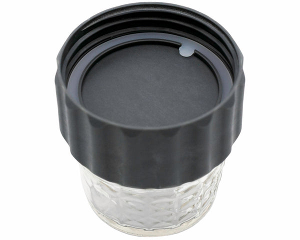 Clear glass tumbler with a black lid on a white background