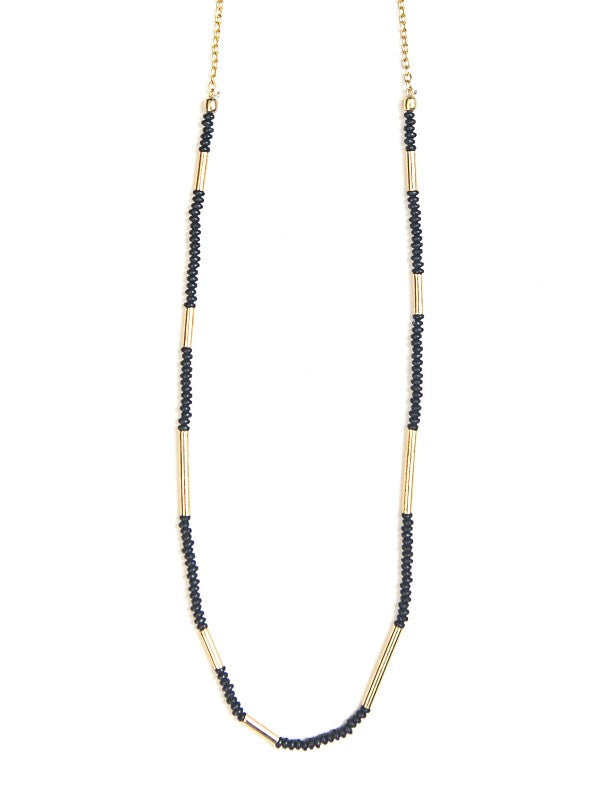 Dainty black seed bead and gold brass Morse Code Necklace on model — fair trade jewellery from India