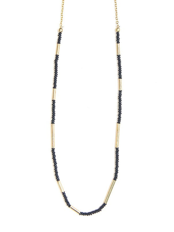Dainty black seed bead and gold brass Morse Code Necklace on model — fair trade jewellery from India