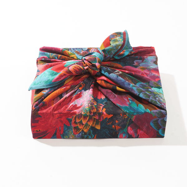 Colorful floral headscarf with a knot on a white background