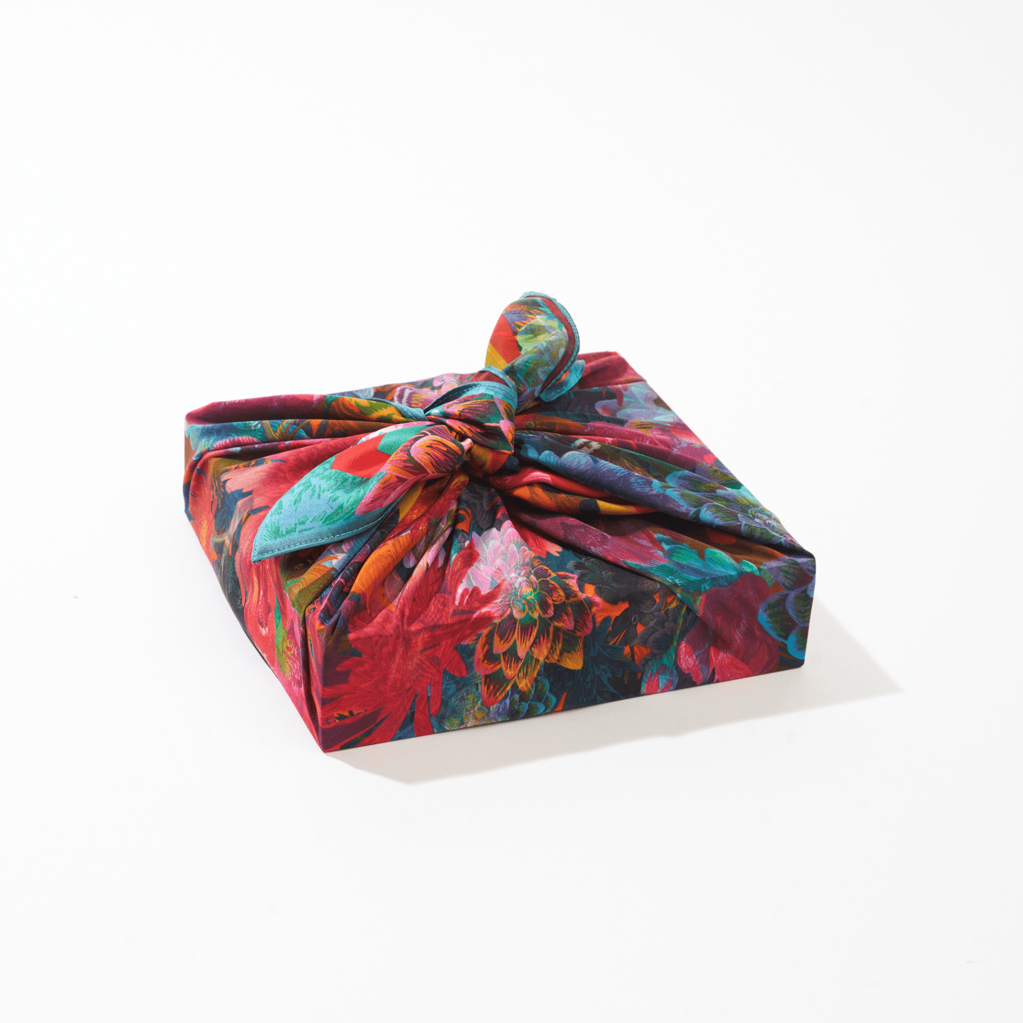 Colorful gift wrap with a knot on a white background
