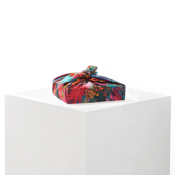 Close-up of Daisy mulberry silk furoshiki wrap showing vibrant floral print from the Delilah Collection