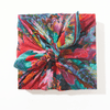 Colorful floral-patterned fabric with a knot on a white background