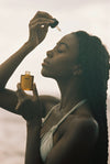 FORAH Dayglow Oil Serum being applied to face, neck and décolleté