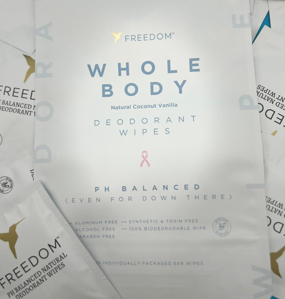 Freedom Whole Body deodorant wipes packaging with branding and product details.