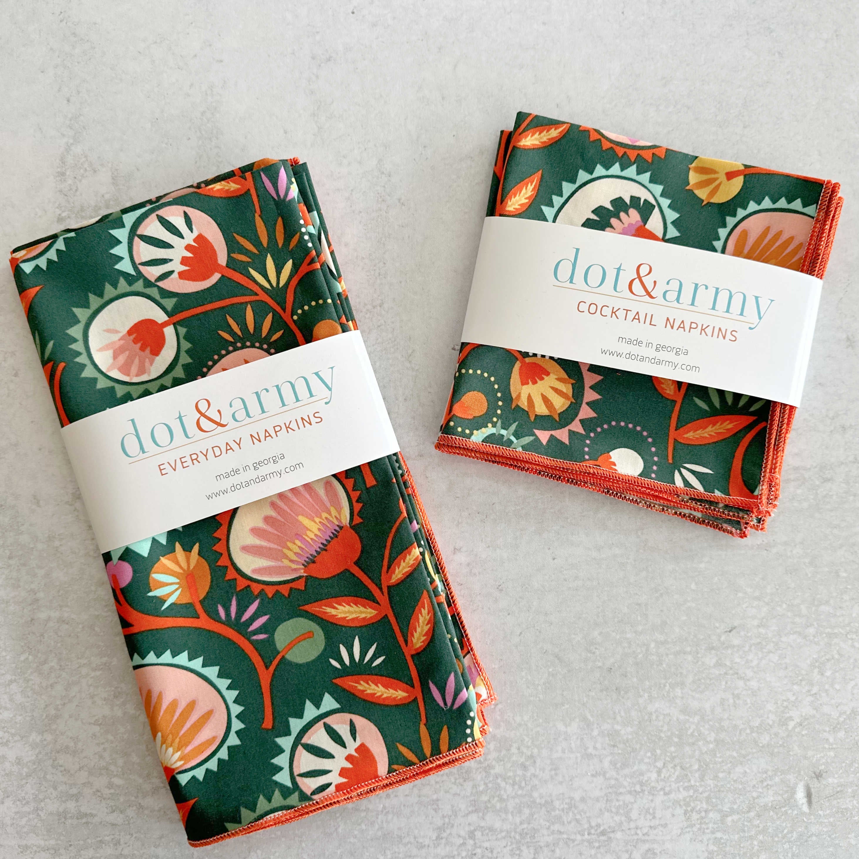 Desert Bloom reusable cloth napkins set of four in bold green, orange, pink and yellow botanical print