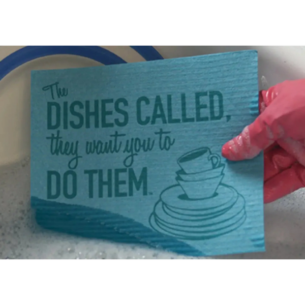 Close-up of the 'Dishes Called' reusable Swedish dishcloth showing bold one-color printed design, 8 x 6.75 inches