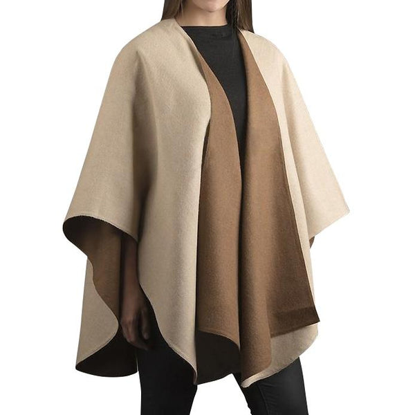 Beige and brown cape worn by a person on a white background