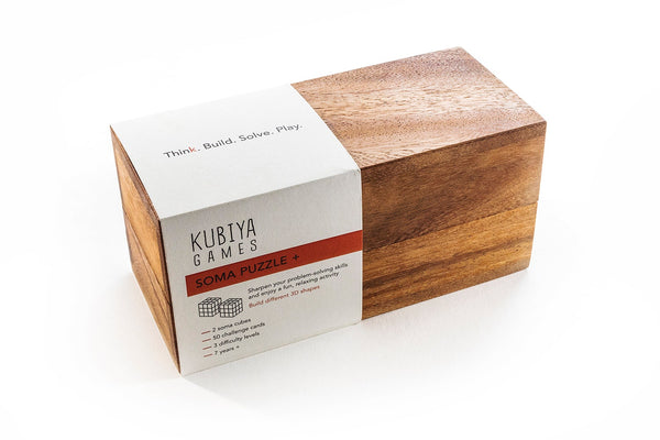 Wooden soma puzzle box with Kubiya Games branding on a white background