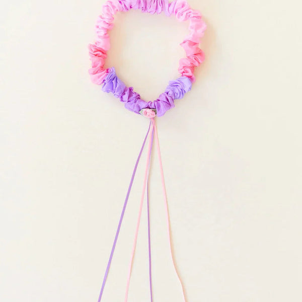 Child wearing Sarah's Silks Blossom Silk Garland on head as a floral headdress for dress-up play
