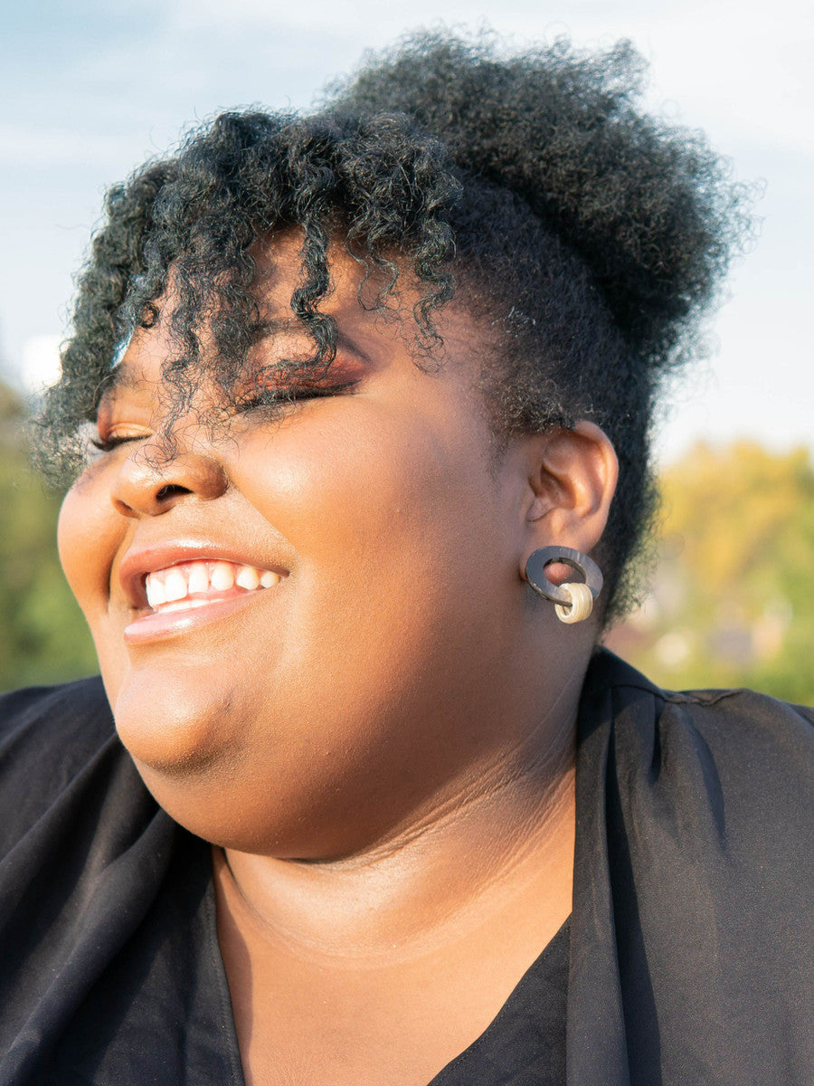 Fair Anita horn stud earrings styled on a model showing size and fit