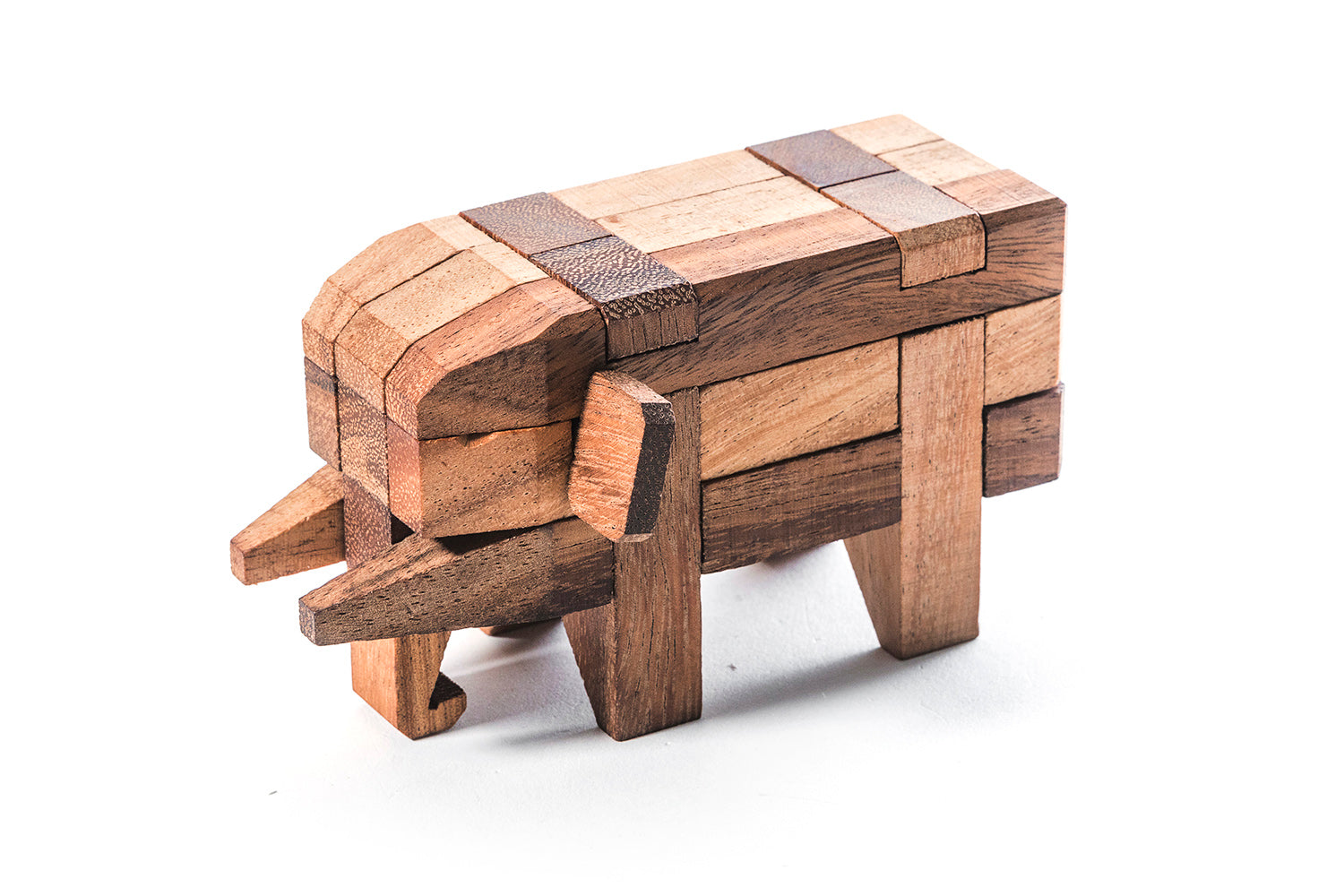 Kubiya Games wooden elephant puzzle with 14 interlocking pieces assembled into an elephant figure