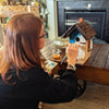 Artist painting with the elseware unplug bamboo watercolor set at a wooden desk