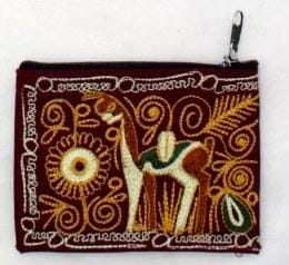 Embroidered pouch with a deer design on a brown background