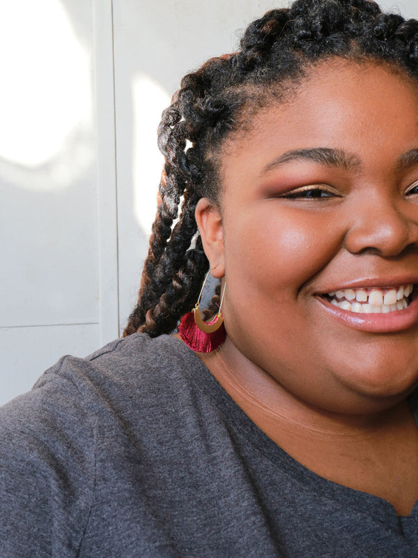 Ethically made fringe hoop earrings by Fair Anita in magenta thread