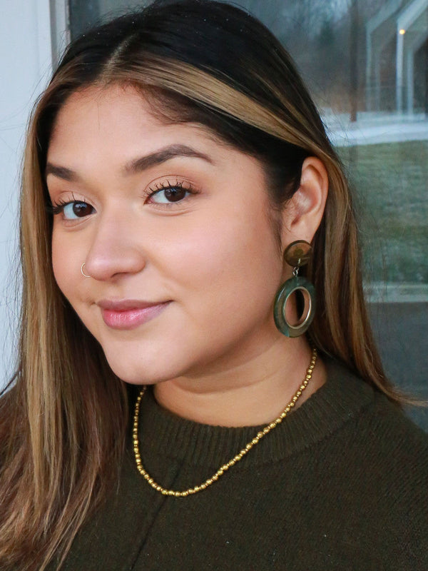Upcycled artillery brass necklace flat lay – nickel-free ethically handcrafted jewellery by Fair Anita